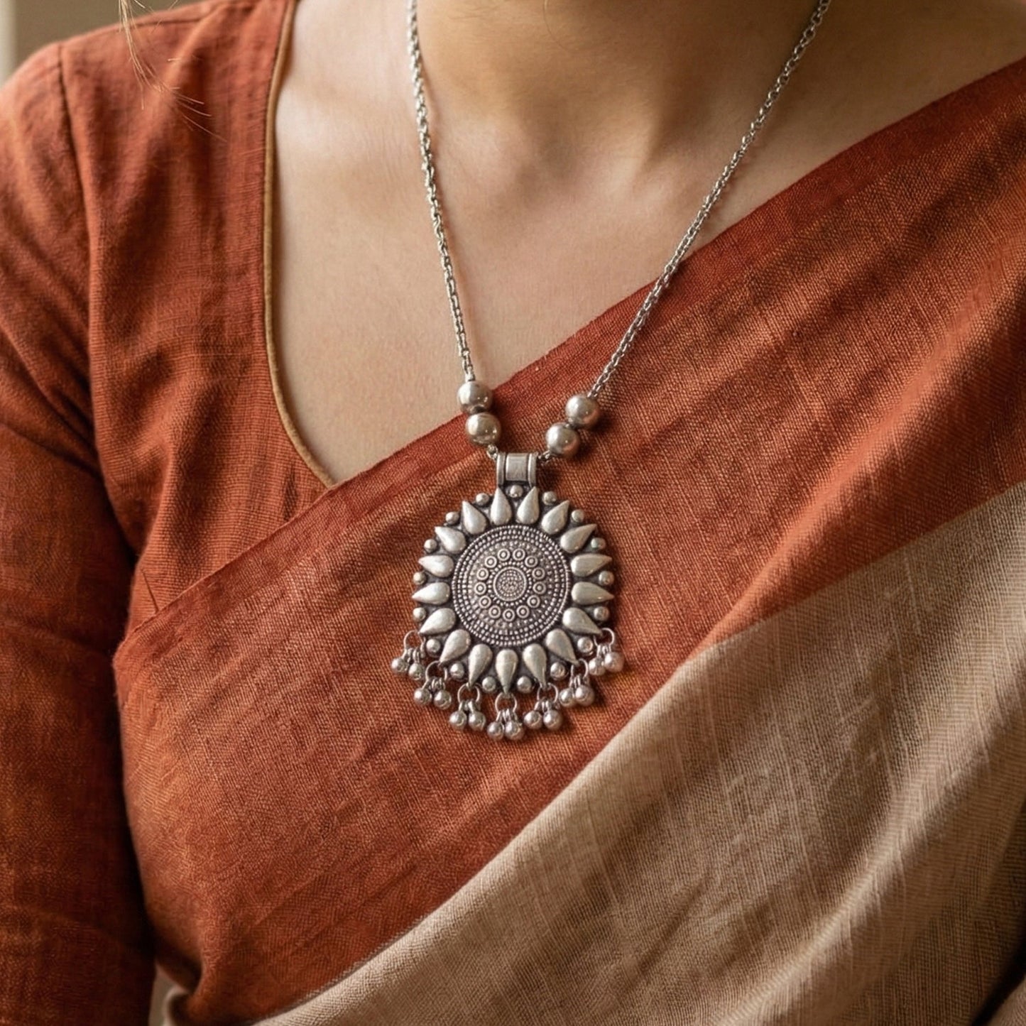 Round silver pendant        
